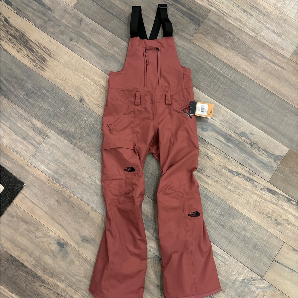 Retail comparison: $275. Women’s North Face ski / snowboard overalls, maroon.